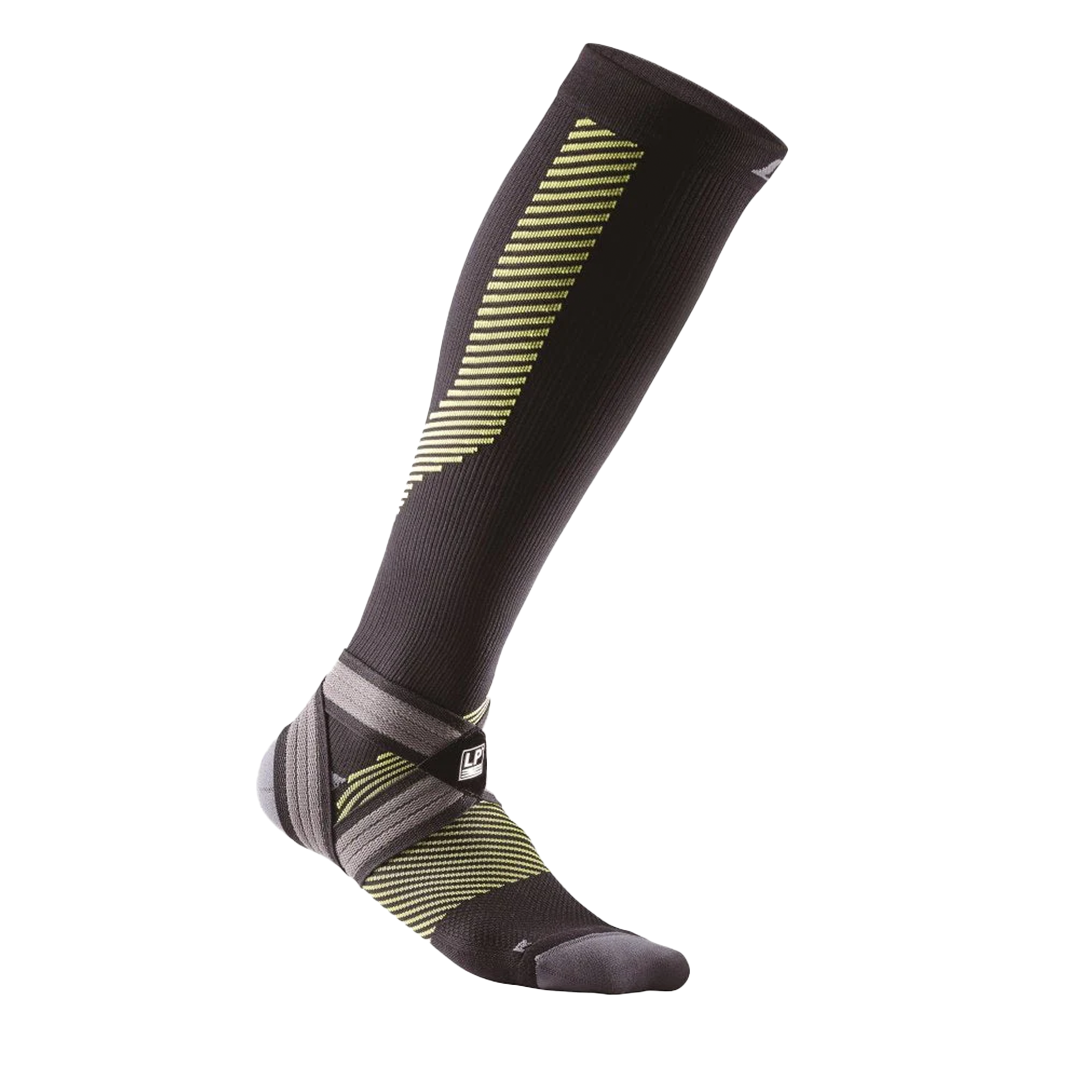 Black knee-high sock with green and black pattern on a white background
