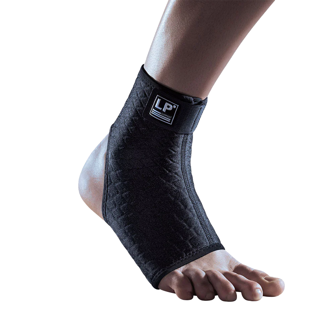 Black ankle support brace on a foot with a white background