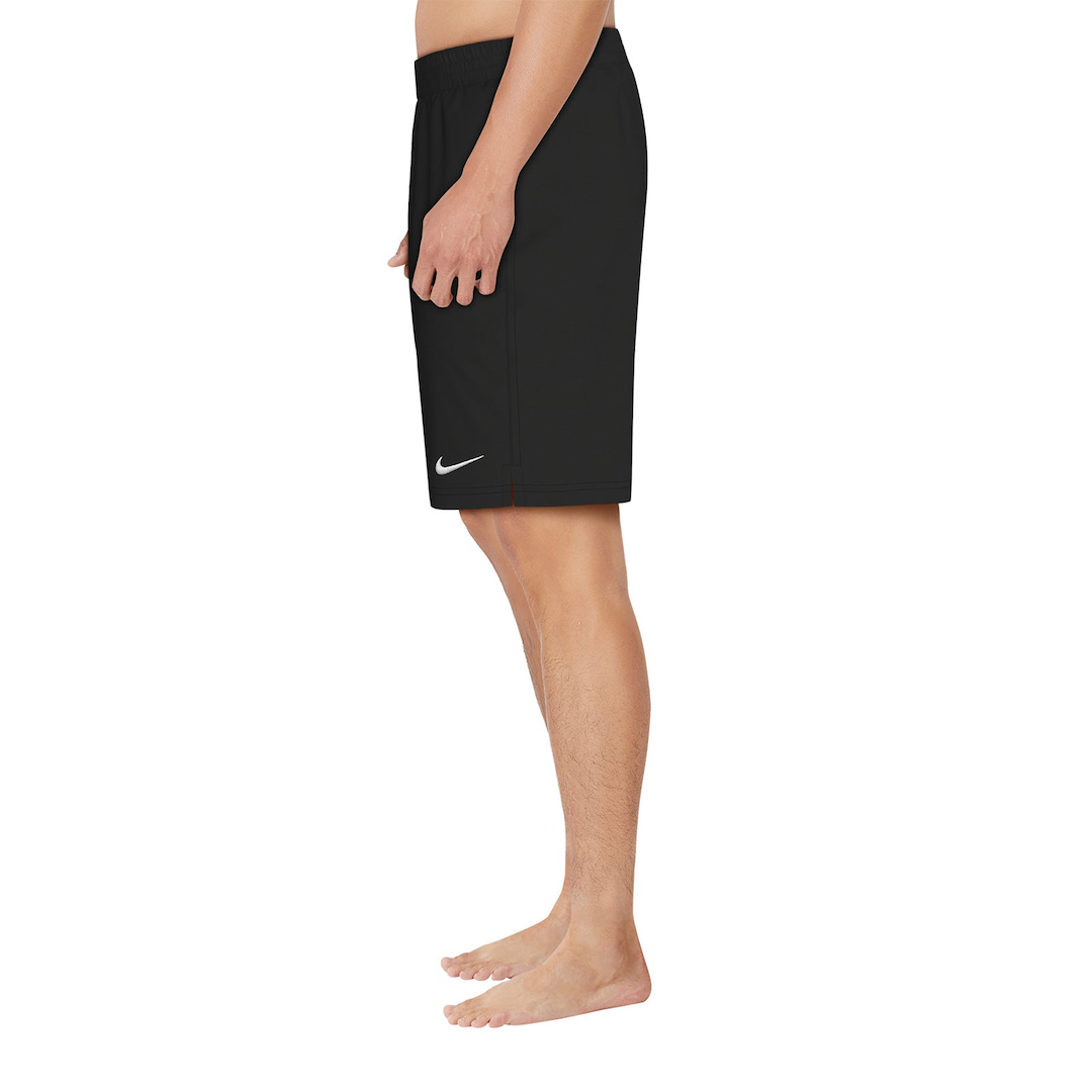 Black Nike shorts worn by a person on a white background