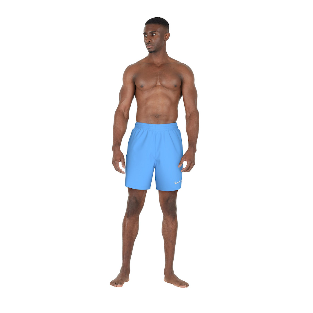 Man wearing blue swim shorts on a white background