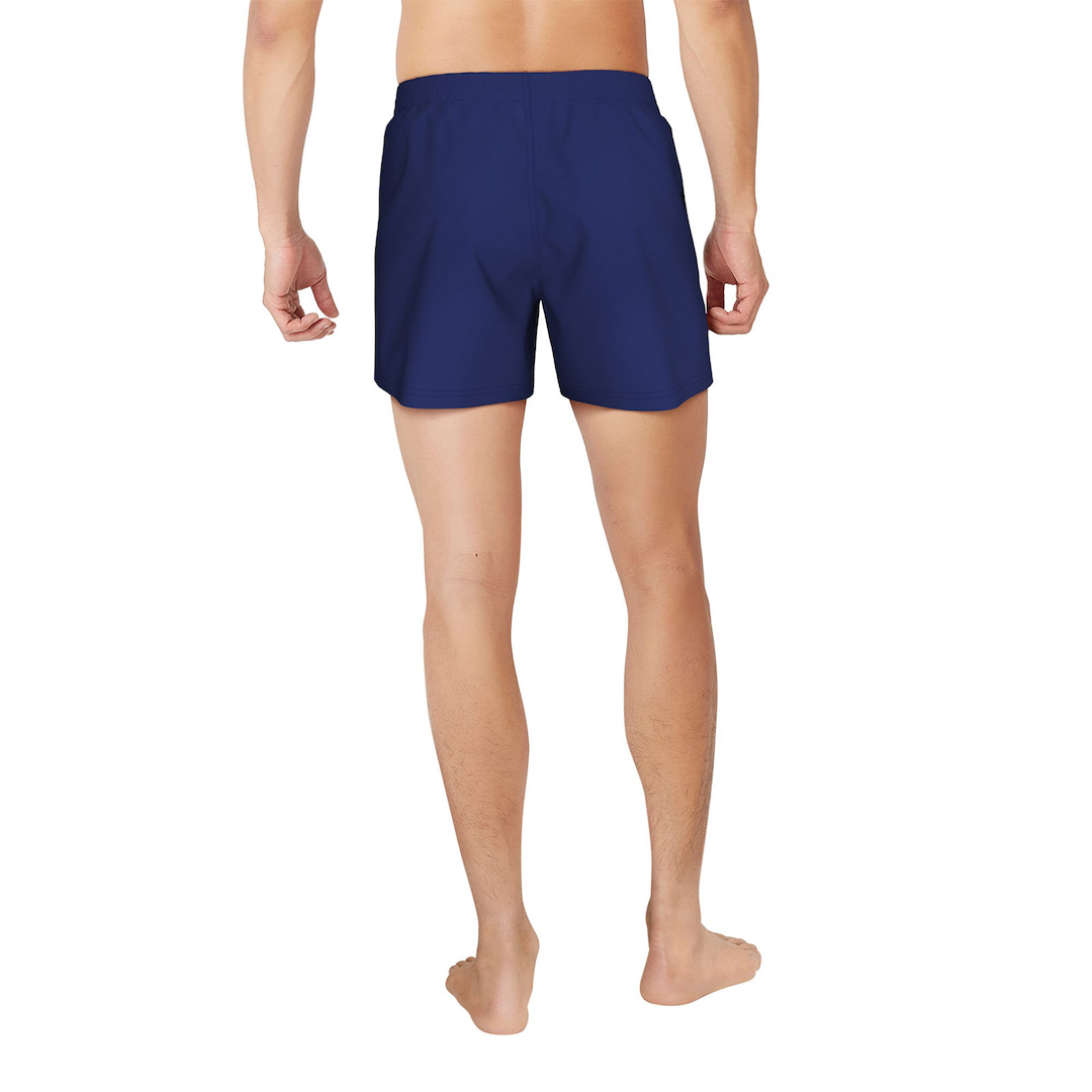 Person wearing blue swim shorts on a white background