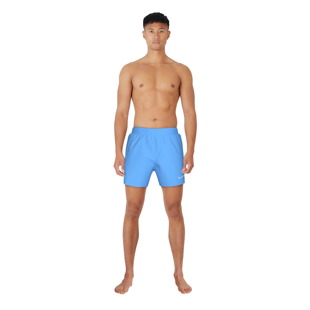 Man wearing blue swim shorts on a white background