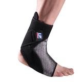 Black ankle support brace on a person's foot with a visible brand logo.