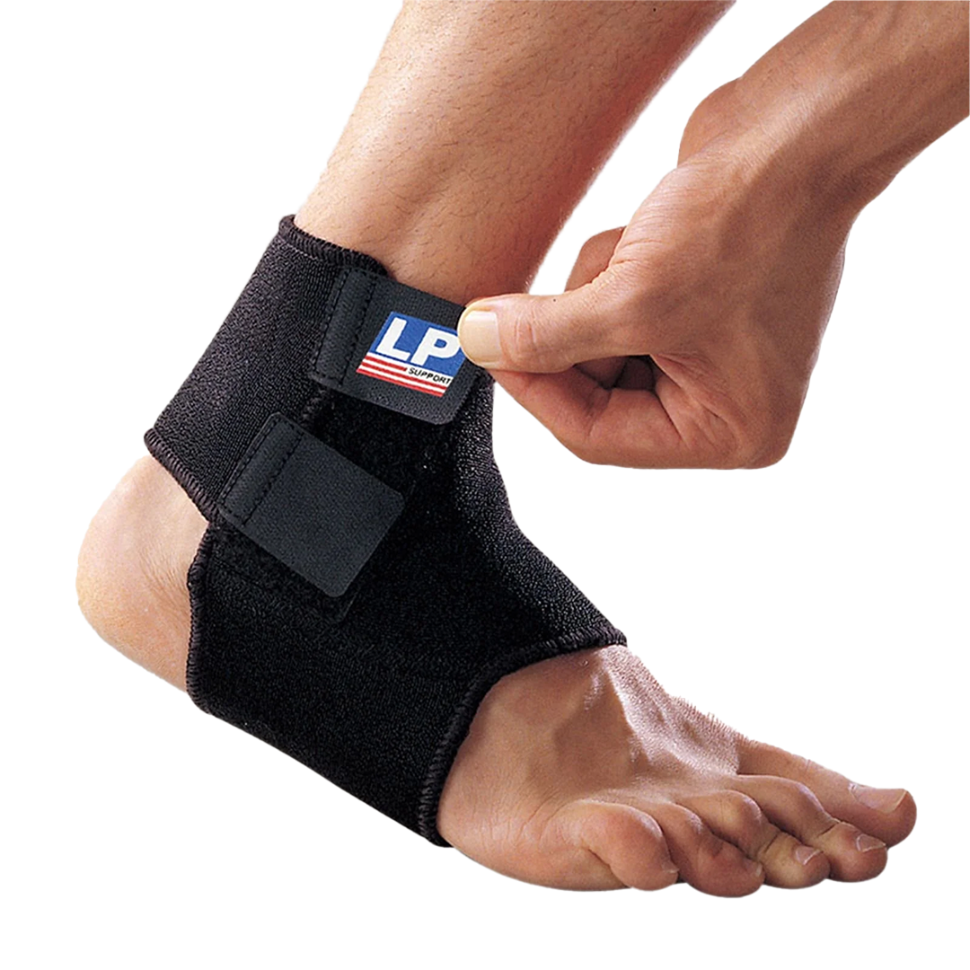Black ankle support brace being worn on a foot with a visible brand logo.
