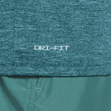 Close-up of teal fabric with 'DRI-FIT' logo