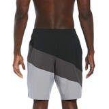 Color-blocked athletic shorts worn by a person on a white background