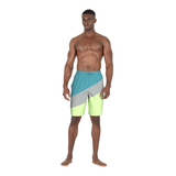 Man wearing a colorful swim shorts on a white background