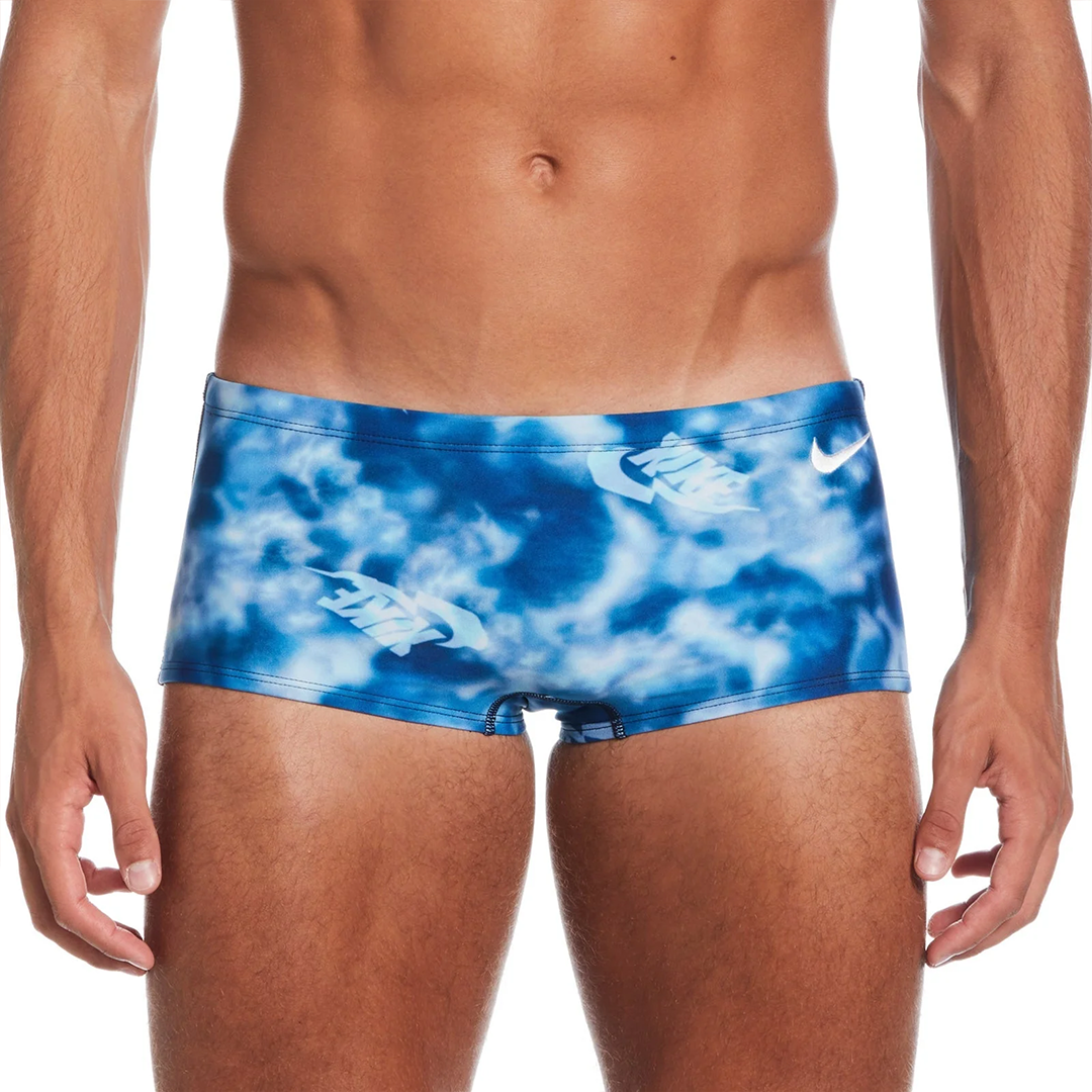 Blue tie-dye swim briefs with a brand logo on a white background