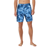 Blue tie-dye swim shorts worn by a person on a white background