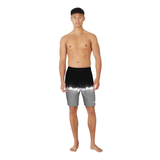 Man wearing black and gray swim shorts on a white background