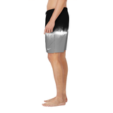 Person wearing black and gray gradient shorts with a Nike logo on a white background