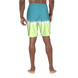 Person wearing a green and yellow gradient swim shorts on a white background