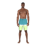 Man wearing a blue and green tie-dye swim shorts on a white background