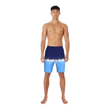 Man wearing blue and white tie-dye swim shorts on a white background