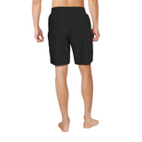Black shorts worn by a person on a white background