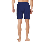 Person wearing navy blue shorts on a white background