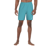 Teal shorts with a Nike logo worn by a person on a white background