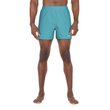 Person wearing teal shorts on a white background