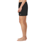 Person wearing a black Nike skirt on a white background